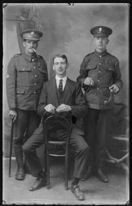 [Two soldiers and a civilian]
