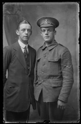 [Lance Corporal in the Kings Royal Rifle Corps with man in civilian clothing]