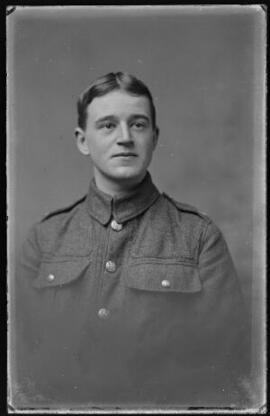[Vignetted head and and shoulders portrait of a soldier]
