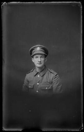 [Head and shoulders portrait of a young soldier in the Welsh Regiment]