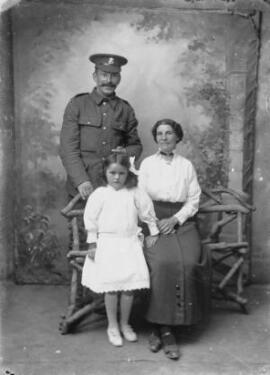 [Welsh Regiment private with his wife and daughter]