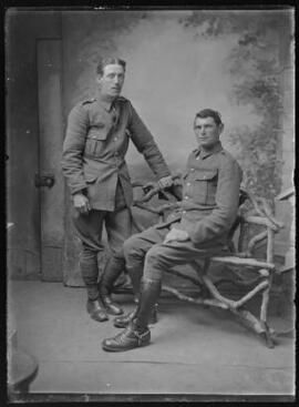 [Two soldiers and a rustic bench]