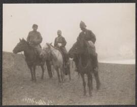 [Three Mongolians on horseback]