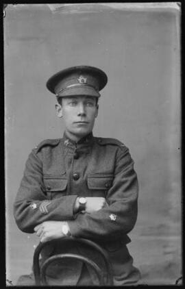[Canadian Warrant Officer with three overseas service chevrons]