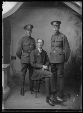 [Two soldiers and a civilian.]