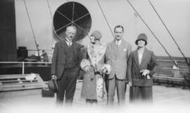 [Two couples, including A. J. Sylvester, aboard a ship]